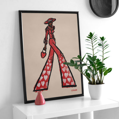 Affiche murale design Pastielle Maud – affiche fashion d'une femme habillée en rouge sur fond beige, cadre posé sur un meuble blanc avec une plante verte